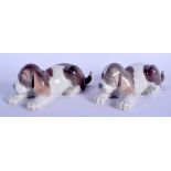A PAIR OF LLADRO PORCELAIN FIGURES OF SLEEPING HOUNDS. 15 cm wide.