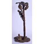 A LARGE CONTEMPORARY CONTINENTAL COLD PAINTED BRONZE PALM TREE modelled with two attendants. 26 cm