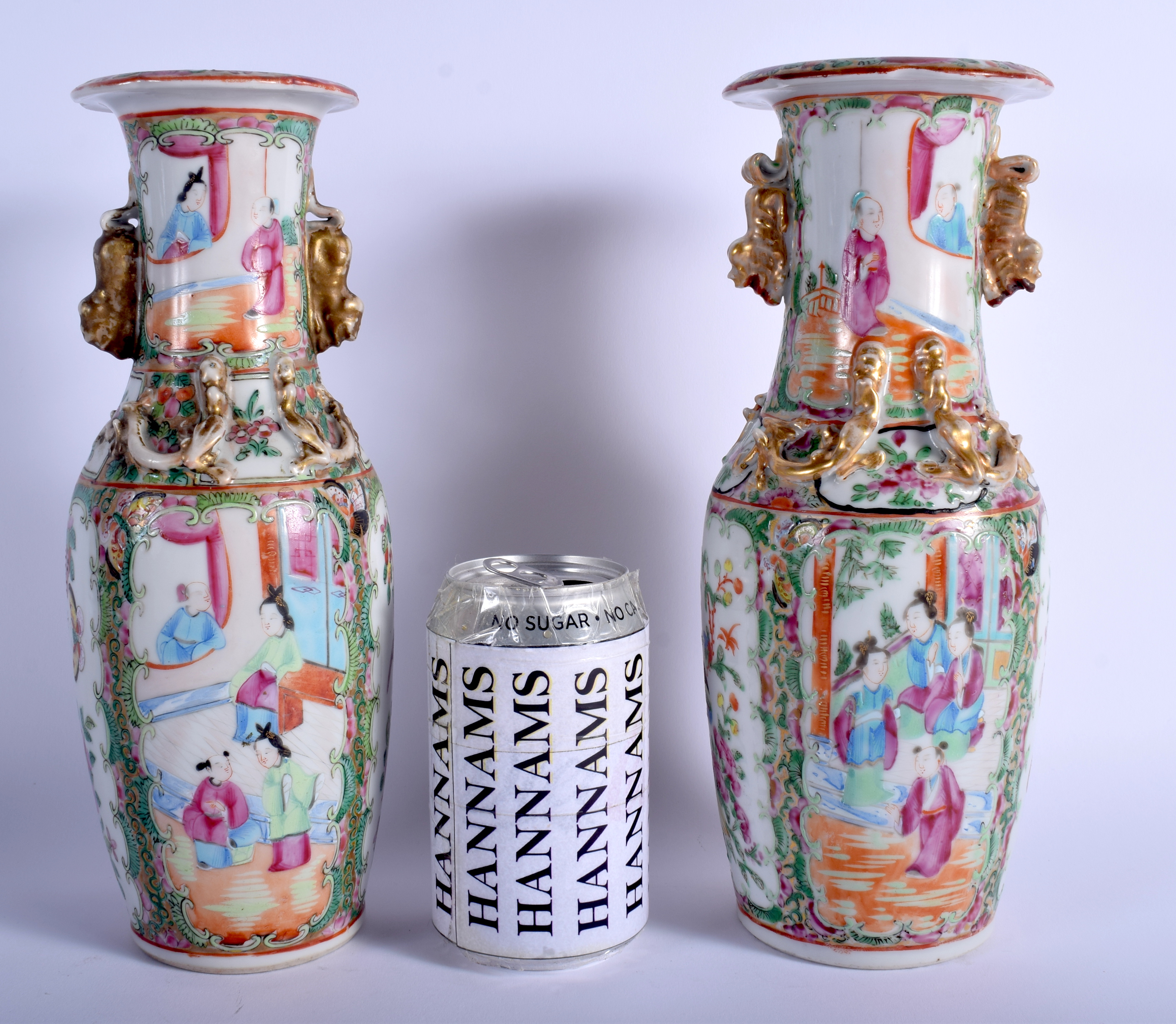 A NEAR PAIR OF 19TH CENTURY CHINESE CANTON FAMILLE ROSE VASES Qing. 26 cm high.