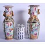 A NEAR PAIR OF 19TH CENTURY CHINESE CANTON FAMILLE ROSE VASES Qing. 26 cm high.