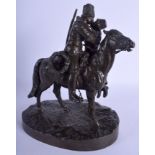 A 19TH CENTURY RUSSIAN BRONZE FIGURE OF A COSSACK AND FEMALE modelled upon a naturalistic base. 27