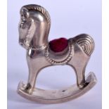 A SILVER ROCKING HORSE PIN CUSHION. 5 cm x 5 cm.