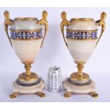 A LARGE PAIR OF 19TH CENTURY FRENCH CHAMPLEVE ENAMEL AND ORMOLU URNS decorated with bands of foliag