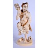 A FINE 19TH CENTURY JAPANESE MEIJI PERIOD CARVED IVORY OKIMONO modelled as oni dancing. 15.5 cm hig