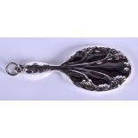 A MINIATURE SILVER MIRROR. 7.5 cm wide.