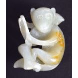 AN EARLY 20TH CENTURY CHINESE GREEN JADE FIGURE OF A MONKEY Late Qing/Republic. 3.25 cm x 2.75 cm.