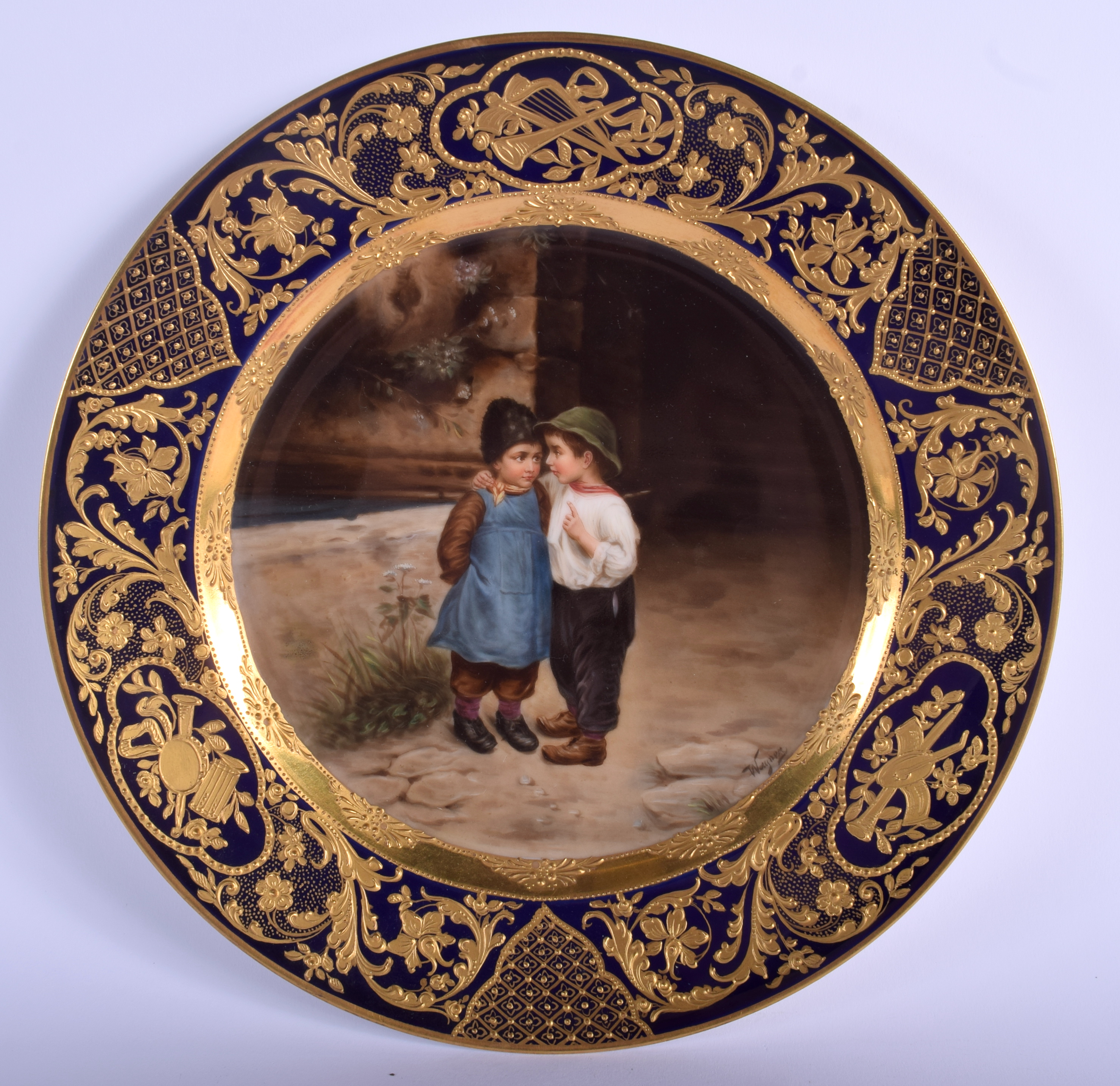 A FINE VIENNA PORCELAIN CABINET PLATE painted with two children within a richly gilded border. 22 c