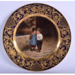 A FINE VIENNA PORCELAIN CABINET PLATE painted with two children within a richly gilded border. 22 c