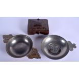 A MIDDLE EASTERN TREEN CARVED WOOD SPICE BOX together with two pewter wine tasters. Largest 27 cm w