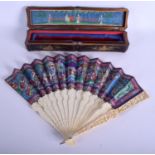 A MID 19TH CENTURY CHINESE CANTON IVORY FAN Qing, decorated with various figures within landscapes.