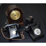 Two vintage Bakelite telephones, mantle clock and a Brownie camera