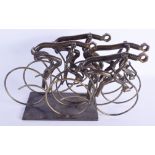 A CONTEMPORARY SCULPTURE OF CYCLISTS. 40 cm x 24 cm.