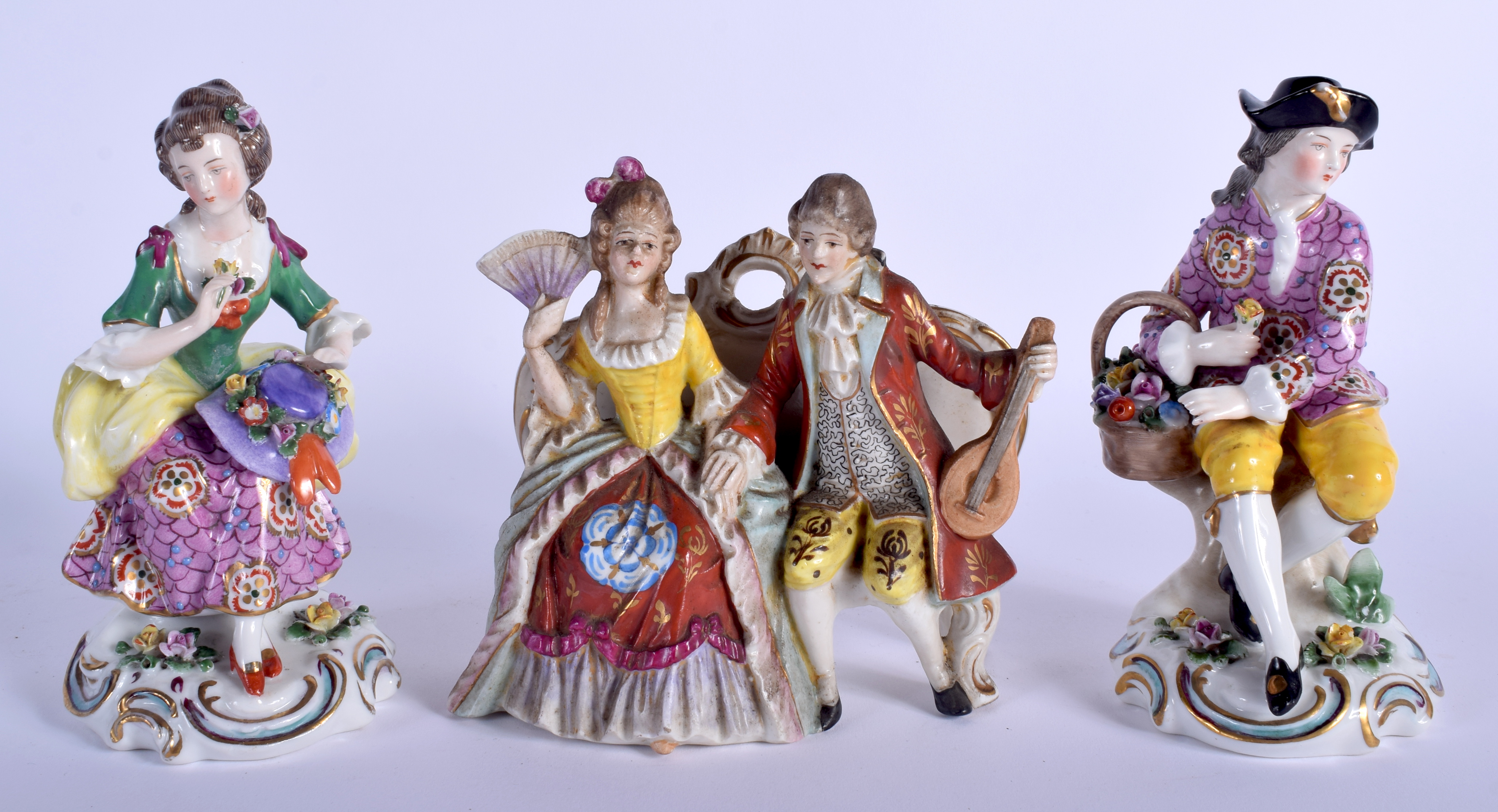 THREE EARLY 20TH CONTINENTAL PORCELAIN FIGURES in various forms and sizes. Largest 13 cm x 11 cm. (