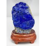 A Lapis lazuli carved boulder with stand 13 x 9 cm