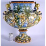 A VERY LARGE 19TH CENTURY ITALIAN TWIN HANDLED MAJOLICA VASE painted with figures within landscapes