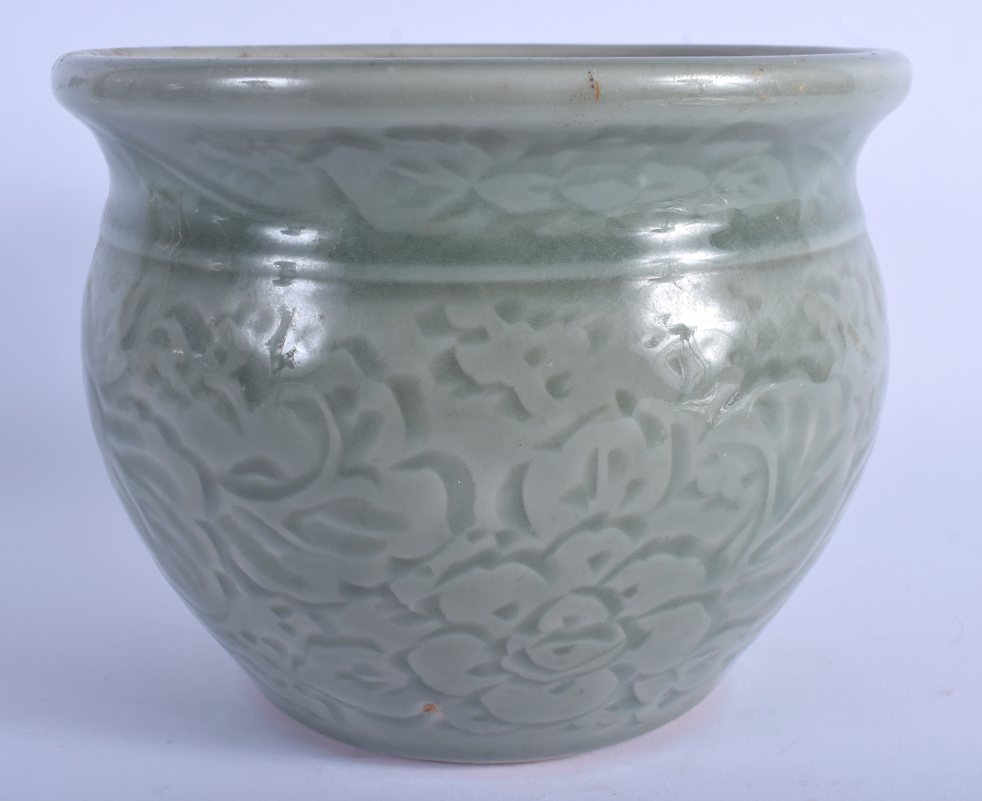 A 19TH CENTURY CHINESE CELADON POTTERY JARDINIERE decorated with foliage and vines. 13 cm x 16 cm. - Image 2 of 4