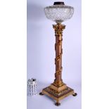 A 19TH CENTURY FRENCH BRONZE CORINTHIAN COLUMN OIL LAMP overlaid with acanthus. 58 cm high.