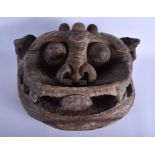 A RARE LARGE 19TH CENTURY POLYCHROMED WOOD TIBETAN RITUAL MASK modelled scowling with muted paint r