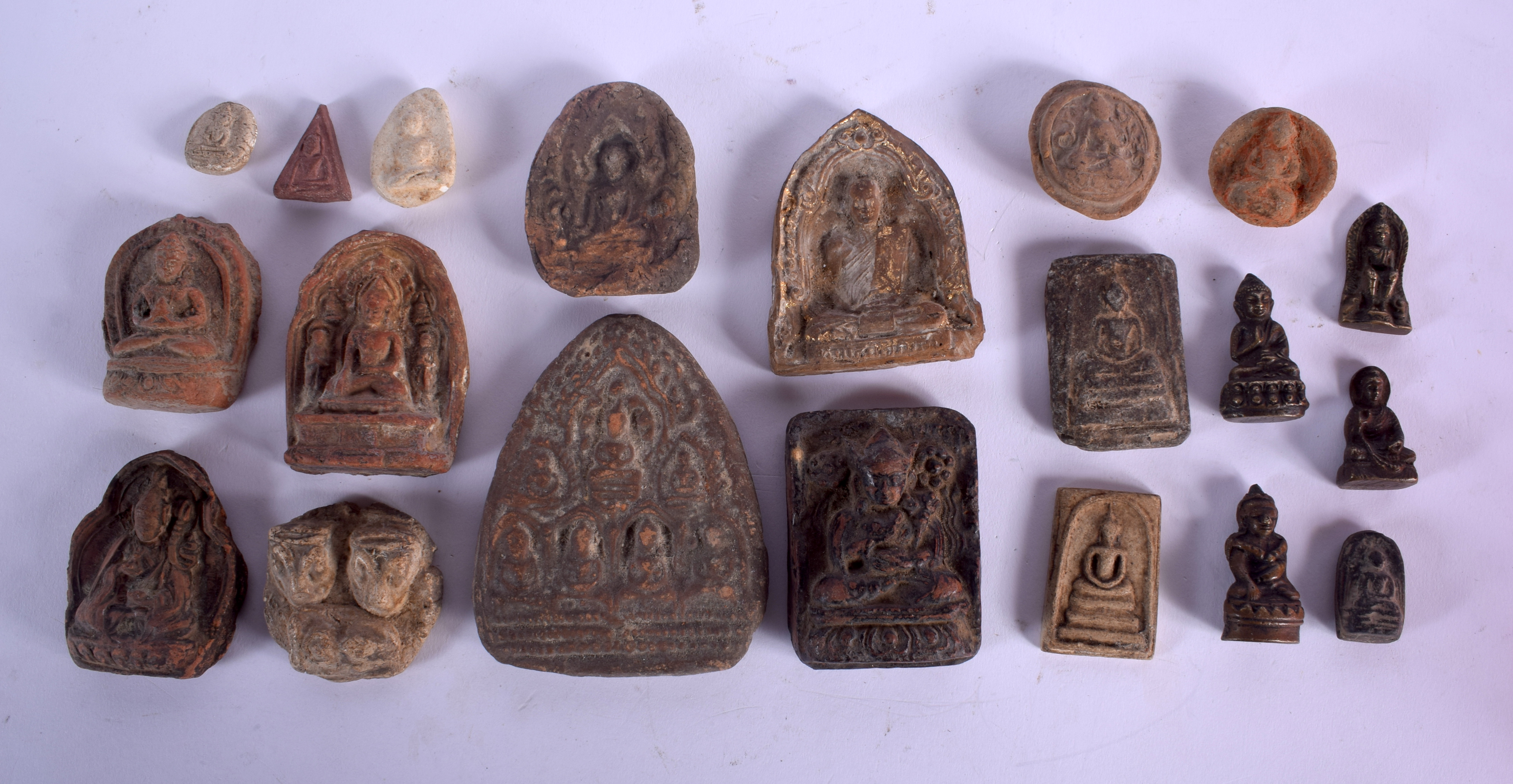 A COLLECTION OF 18TH CENTURY AND LATER BUDDHISTIC FRAGMENTS in various forms and sizes. (qty)