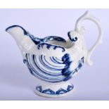 Derby cream boat moulded with dolphins and shells, painted in under glaze blue. 8Cm high
