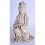 AN 18TH CENTURY CHINESE BLANC DE CHINE PORCELAIN FIGURE OF GUANYIN Qing, modelled in flowing robes.