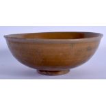 A CHINESE YUAN/MING DYNASTY STONEWARE CELADON TYPE BOWL incised with a flower. 19 cm diameter.