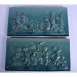 A LARGE PAIR OF 19TH CENTURY BURMANTOFTS POTTERY PLAQUES depicting putti and animals. 39 cm x 20 cm