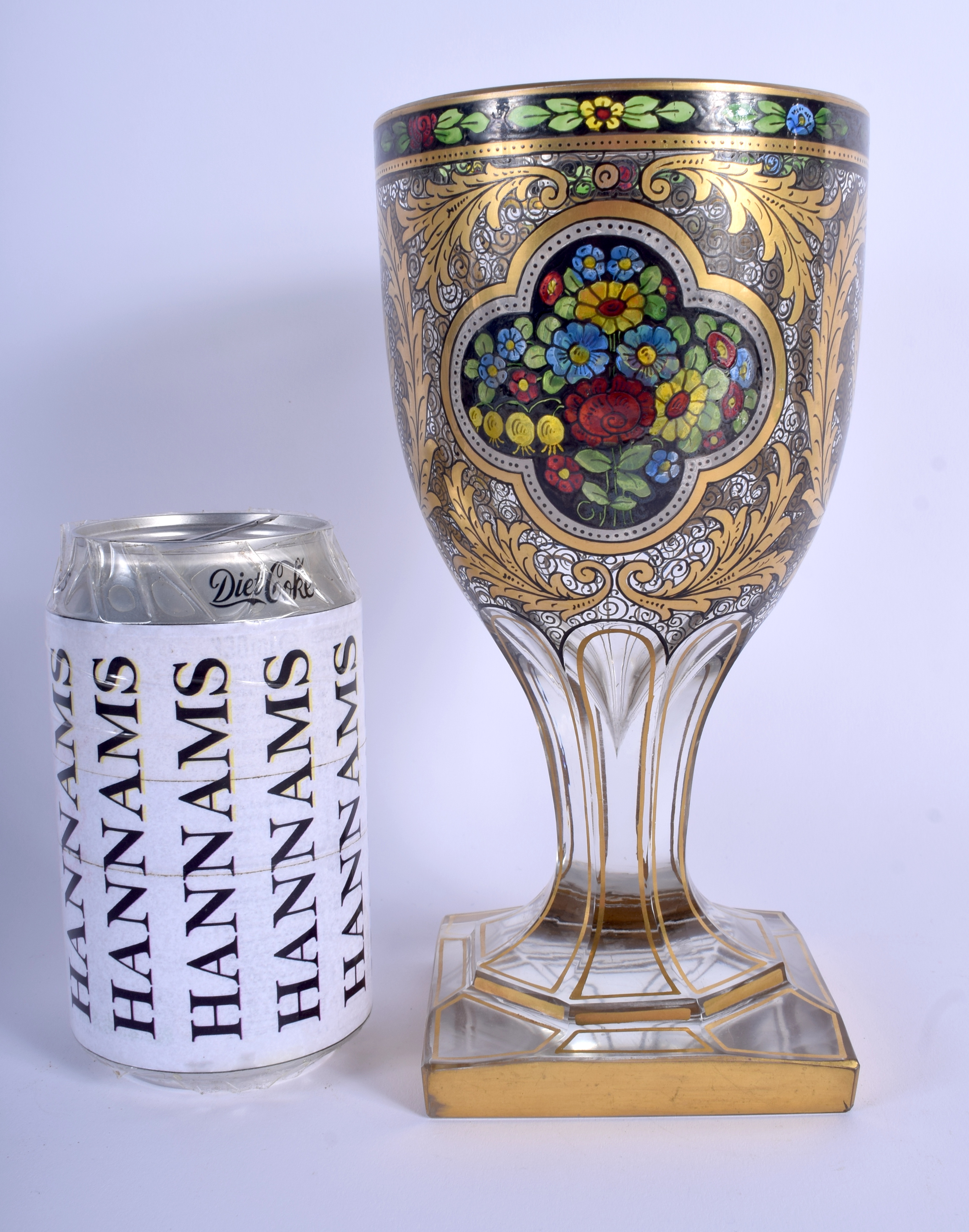 A FINE 19TH CENTURY EUROPEAN ENAMELLED GILDED GLASS GOBLET painted with floral sprays and vines. 21