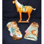 A Chinese porcelain Tang horse and two Chinese dragon wall pockets
