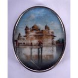 AN ANTIQUE INDIAN PAINTED IVORY MINIATURE within silver mounts. 3.5 cm x 4.5 cm.