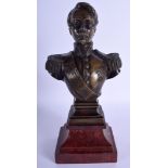 A 19TH CENTURY FRENCH BRONZE BUST OF LOUIS NAPOLEON III upon a red marble base. 29 cm high.