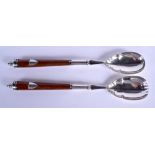 A PAIR OF EDWARDIAN SILVER PLATED OAK SALAD SERVERS. 32 cm long.