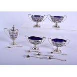 A 19TH CENTURY SILVER CRUET SET by William Comyns. London 1881/5. 850 grams inc liner. (5)