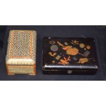 Japanese wooden lacquered box and an Islamic heavily decorated box. (2)