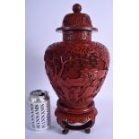 A RARE 19TH CENTURY CHINESE CARVED CINNABAR LACQUER VASE AND COVER Qing, upon a fitted stand. 37 cm