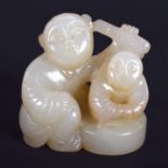 A CHINESE CARVED GREEN JADE FIGURE OF TWO BOYS 20th Century. 3.5 cm x 3.5 cm.