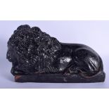 AN ANTIQUE PAINTED TERRACOTTA FIGURE OF THE LION OF LUCERNE modelled upon a rectangular plinth. 30