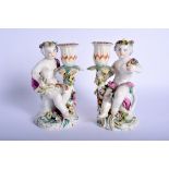 Derby pair of patch mark figures of children holding candle sconces. 16Cm high