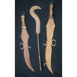 Two wooden handled Islamic knives and another