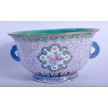 A 19TH CENTURY CHINESE FAMILLE ROSE TWIN HANDLED BOWL Qing, enamelled with floral motifs. 18 cm wid