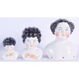 THREE EARLY 20TH CENTURY EUROPEAN PORCELAIN DOLL HEADS. Largest 17 cm x 10 cm. (3)