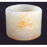AN EARLY 20TH CENTURY CHINESE GREEN JADE ARCHERS RING Late Qing/Republic. 3.25 cm wide.