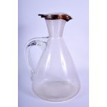 AN ARTS AND CRAFTS SILVER MOUNTED DECANTER. 21.5 cm high.