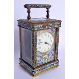 A 19TH CENTURY FRENCH BRASS CHAMPLEVE ENAMEL CARRIAGE CLOCK decorated with foliage. 15 cm high inc