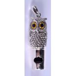 A SILVER OWL WHISTLE. 3.5 cm long.