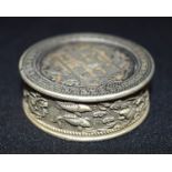 A Chinese white metal embossed coin box 5 x 2 cm