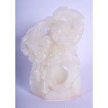 A CHINESE CARVED WHITE JADE NATURALISTIC GROUP 20th Century. 11 cm x 7 cm.