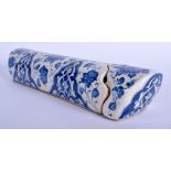A MIDDLE EASTERN TURKISH FAIENCE BLUE AND WHITE PEN BOX AND COVER painted with flowers. 30 cm long.