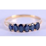 A 14CT GOLD AND SAPPHIRE RING. 2.2 grams. X/Y.