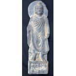 A large Middle Eastern stone Buddha 55 x 13cm